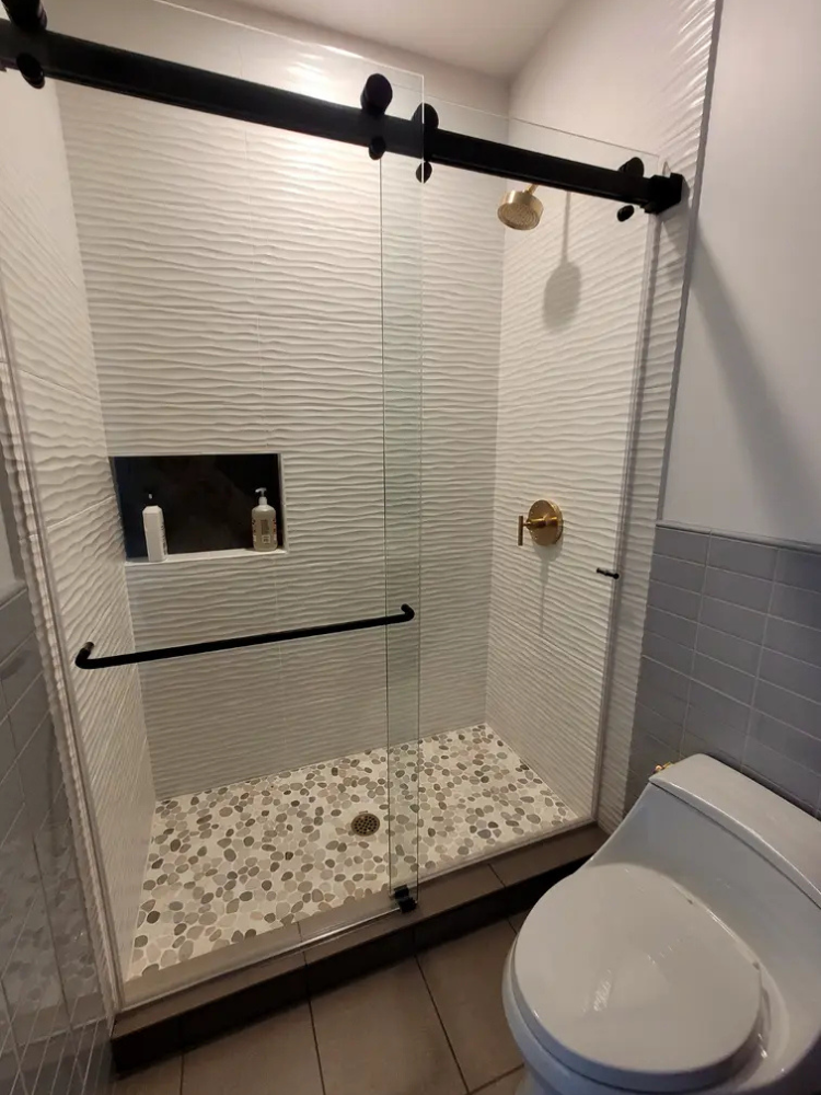 custom shower with gold hardware